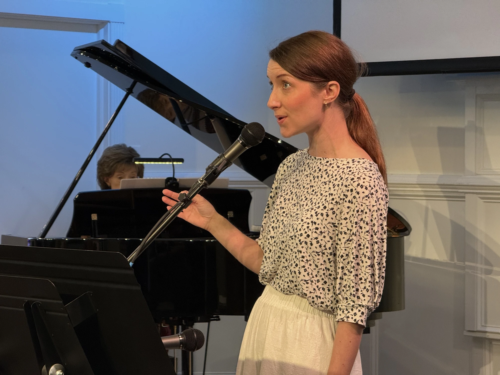 Singer and pianist leading worship music at Rawls Baptist Church.