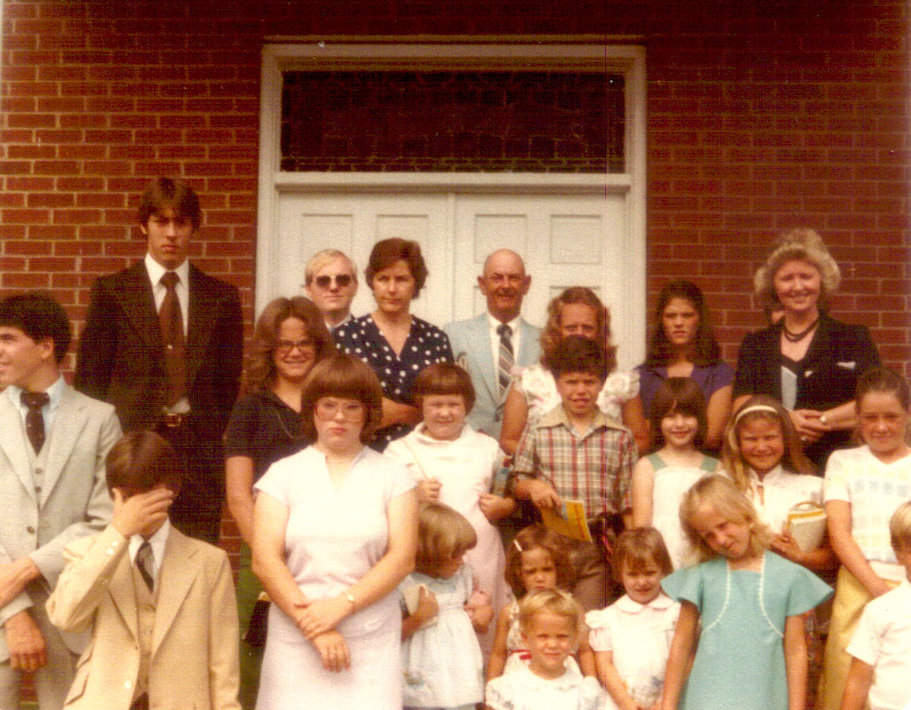Church members standing in front of Rawls Sanctuary in 1981