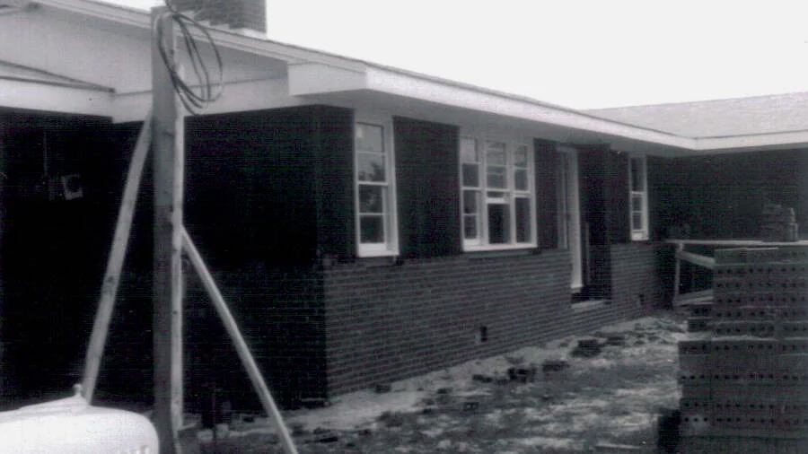 The parsonage nearing completion as exterior brickwork and finishing continued.