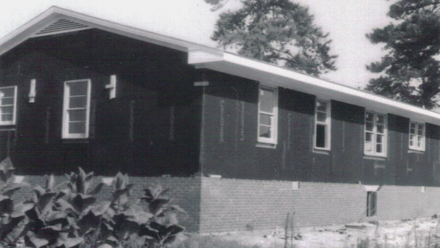 The north side of the parsonage during framing and brick foundation work.