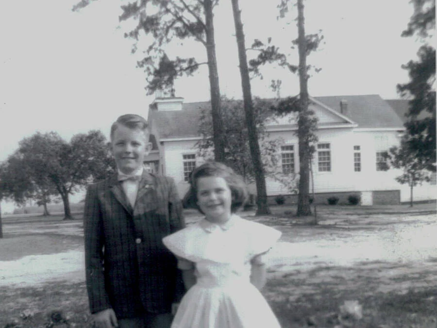 Keith and Martha Matley standing in front of Rawls Baptist Church.