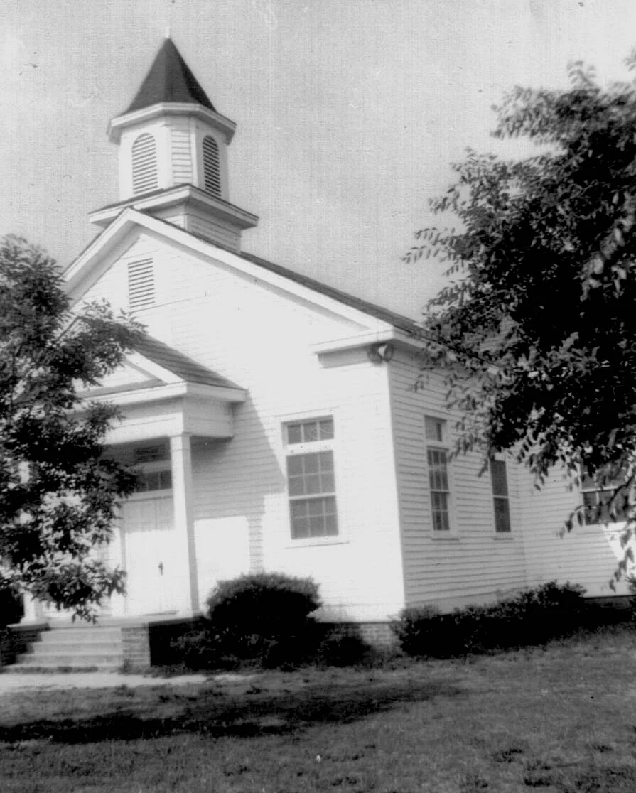 The white wooden Rawls Baptist Church sanctuary before brick veneer was added.