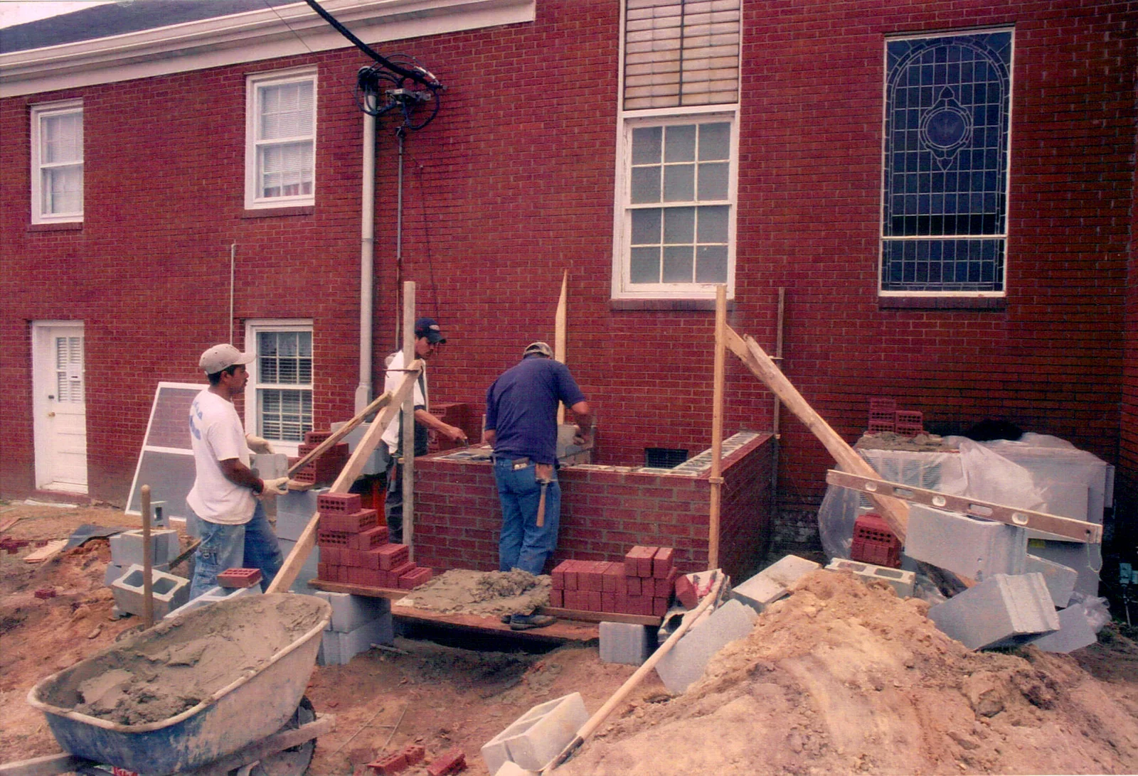 Construction crews beginning masonry work for the new church addition.