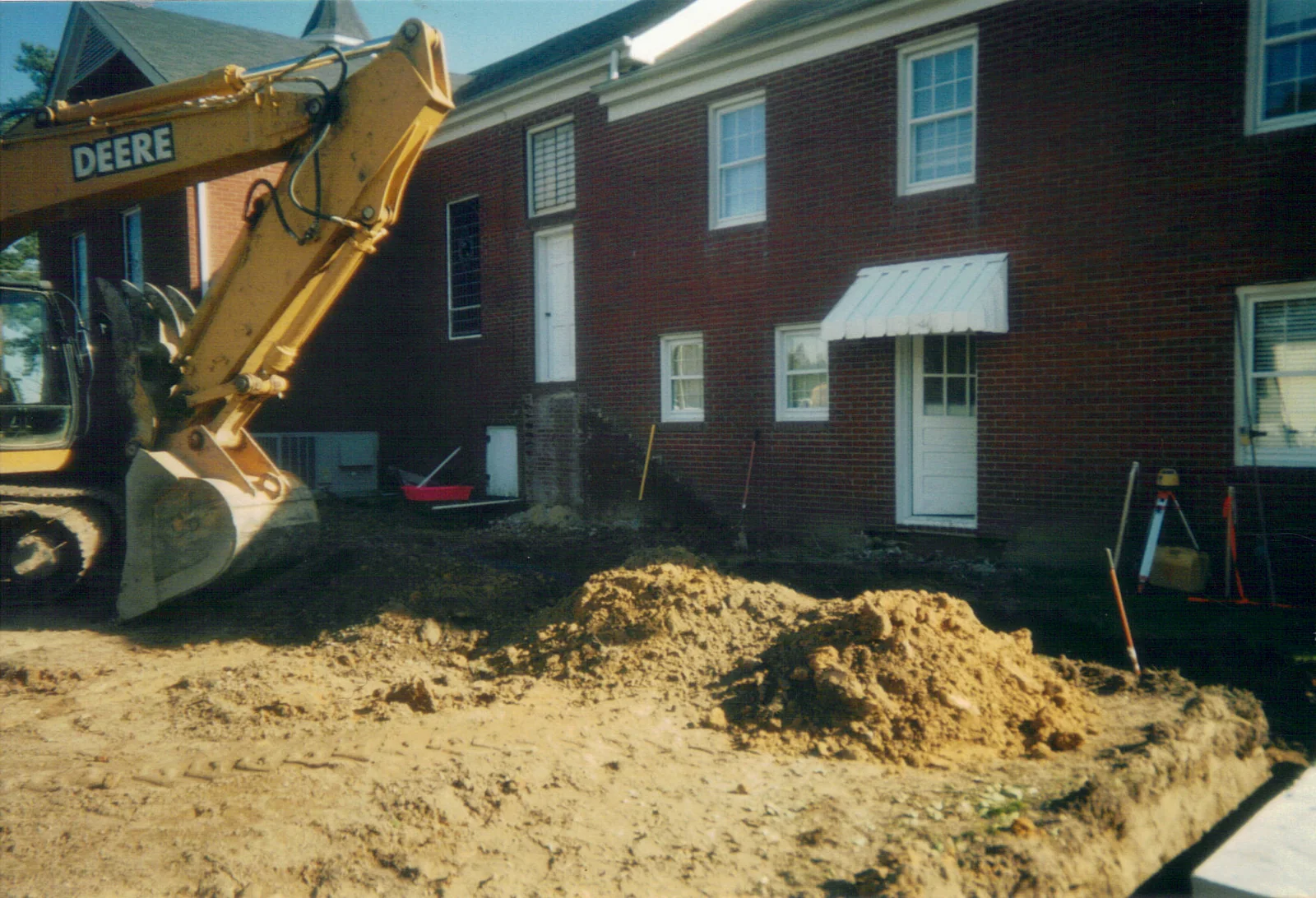 Excavation and early groundwork behind the original church building.