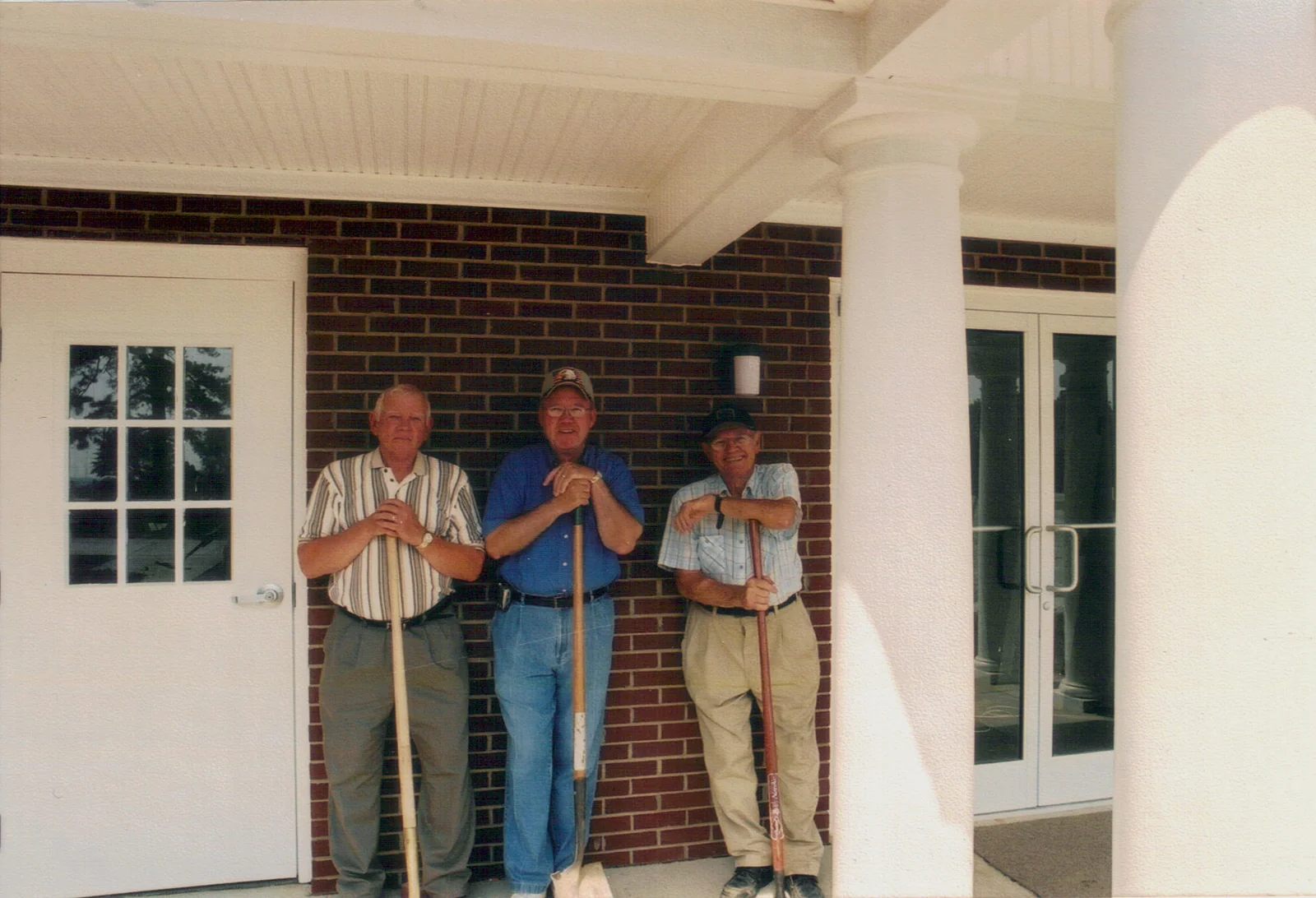 Volunteers completing work around the entrance of the new addition.