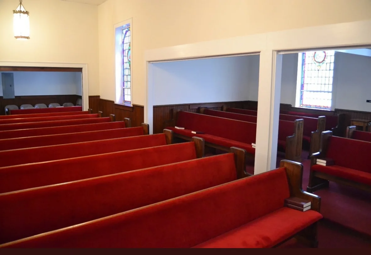 An angled view of the sanctuary seating before renovation.