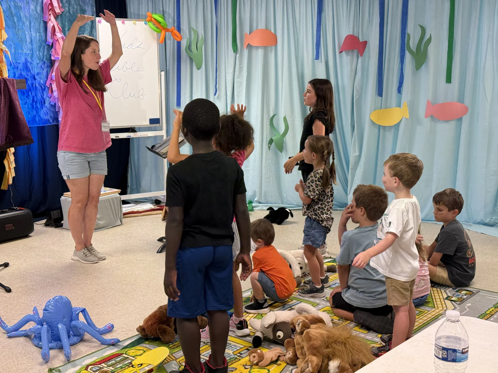 Children gathered for a Bible lesson during Backyard Bible Club.