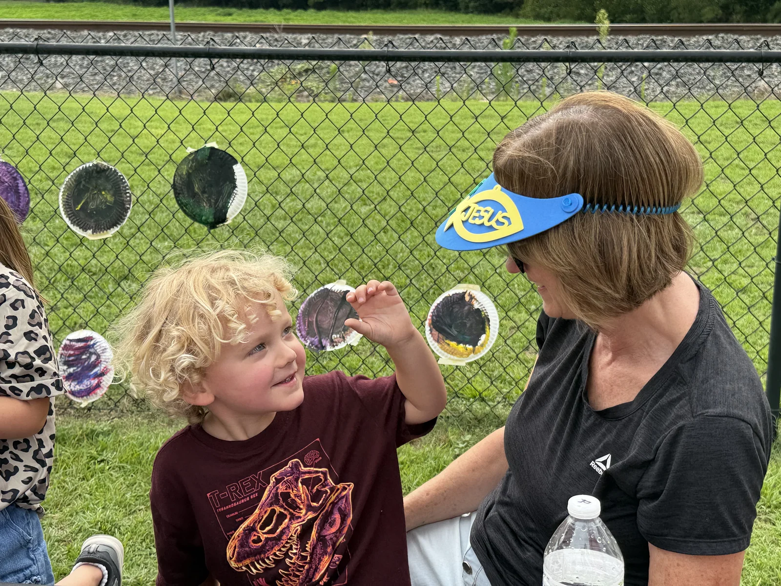 A child and volunteer sharing a moment together during Backyard Bible Club.