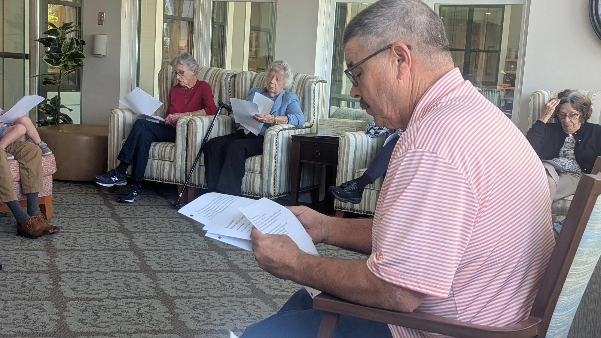Donnie reading from the Bible during a Bible study at Calyx Living.