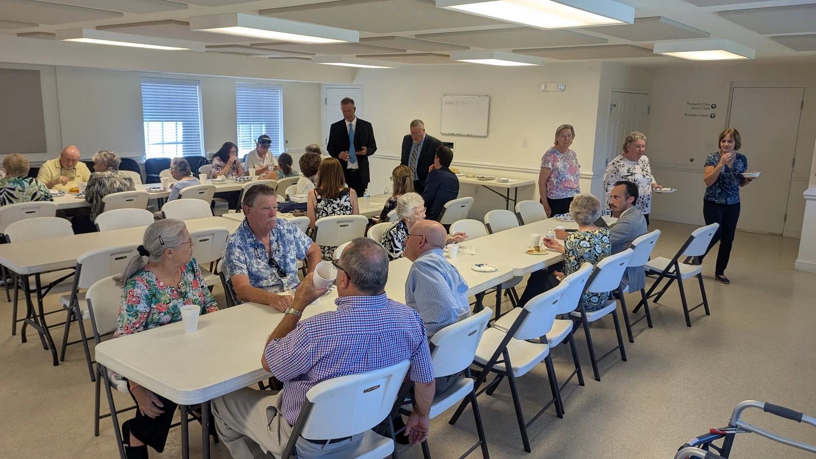 Members of Rawls Baptist Church visiting over a fellowship meal.