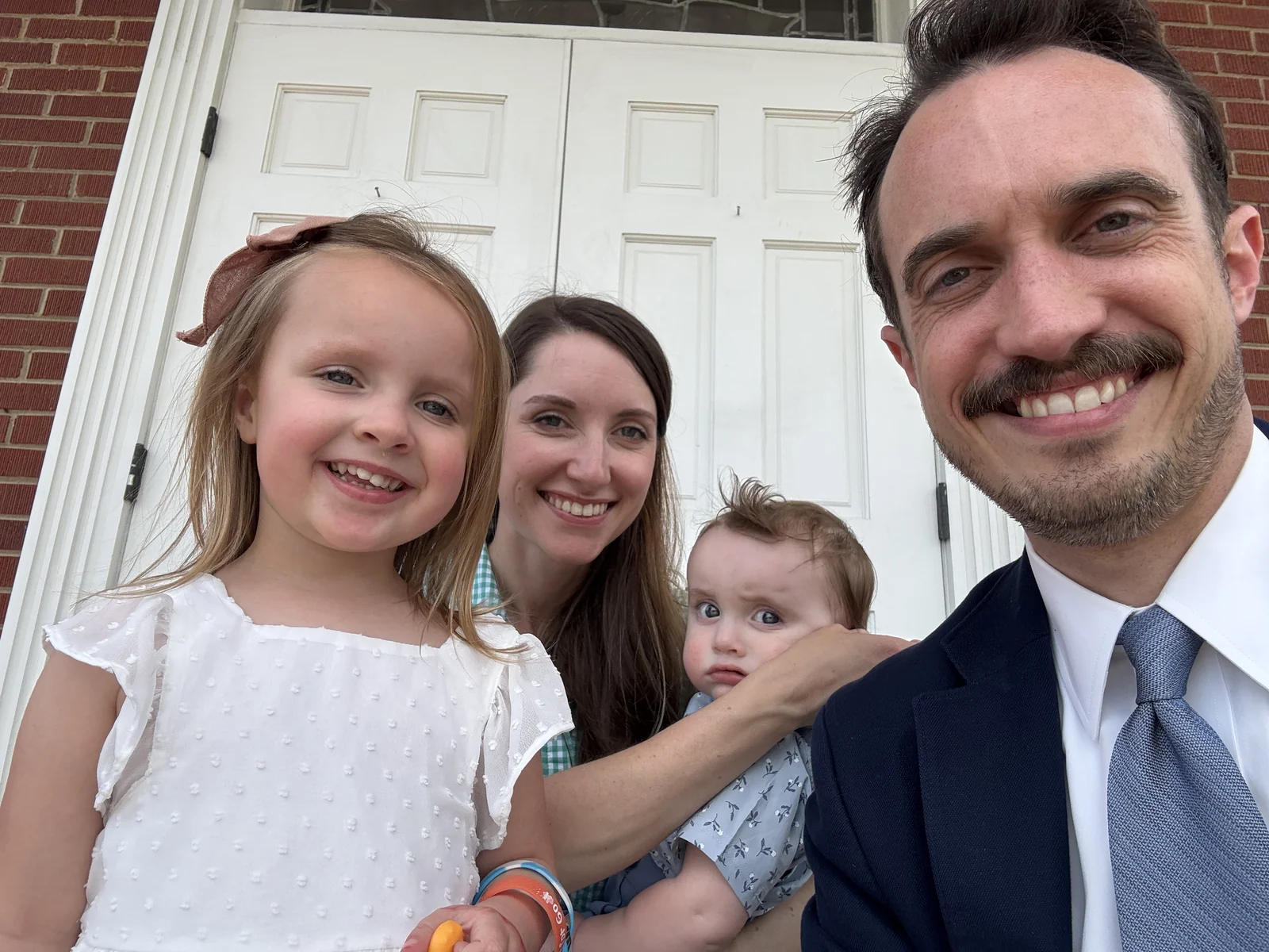 Brandon and Susanna Gaster with their children outside the sanctuary entrance at Rawls Baptist Church.