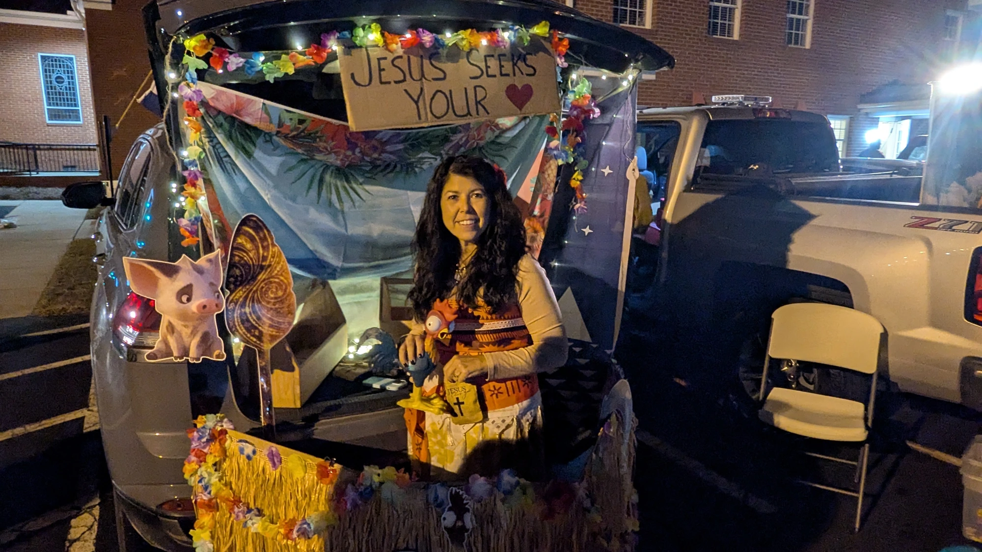 Tropical themed decorated trunk with a faith-based display at Family Fall Fest.