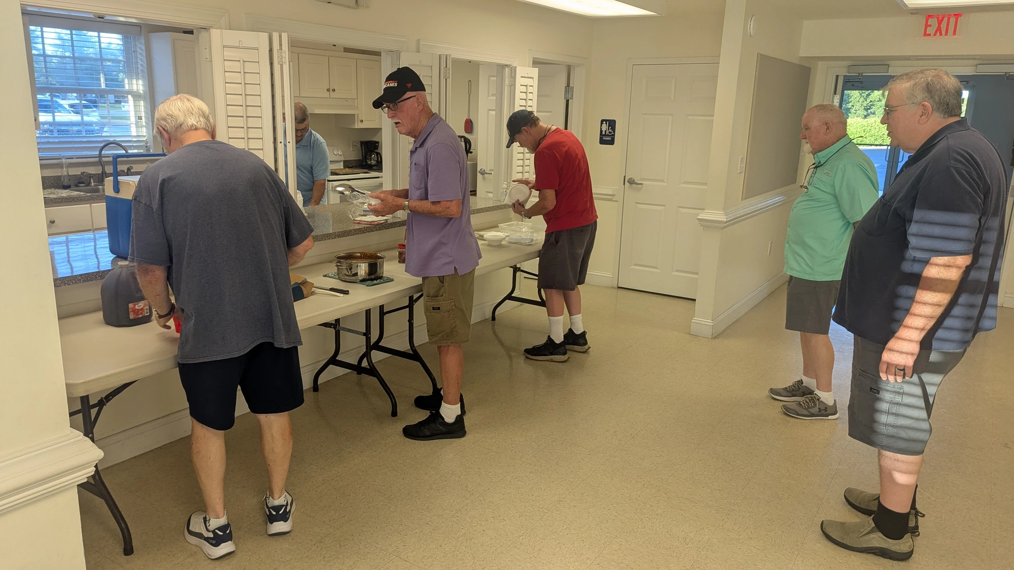 Men gathering for fellowship and a shared meal at Rawls Baptist Church.