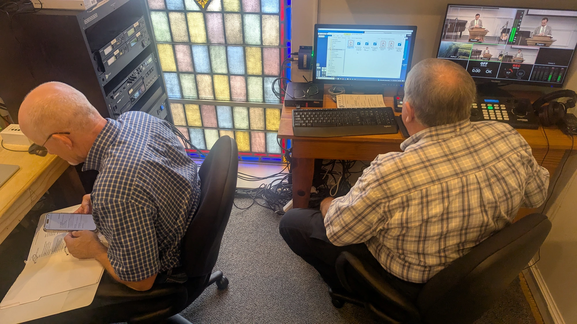 Volunteers serving in the sound booth during Sunday worship at Rawls Baptist Church.