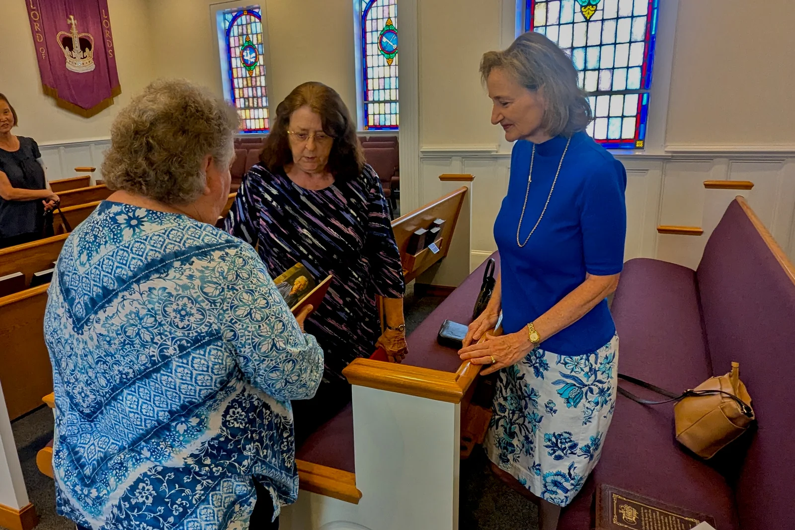Women talking together after Sunday worship at Rawls Baptist Church.