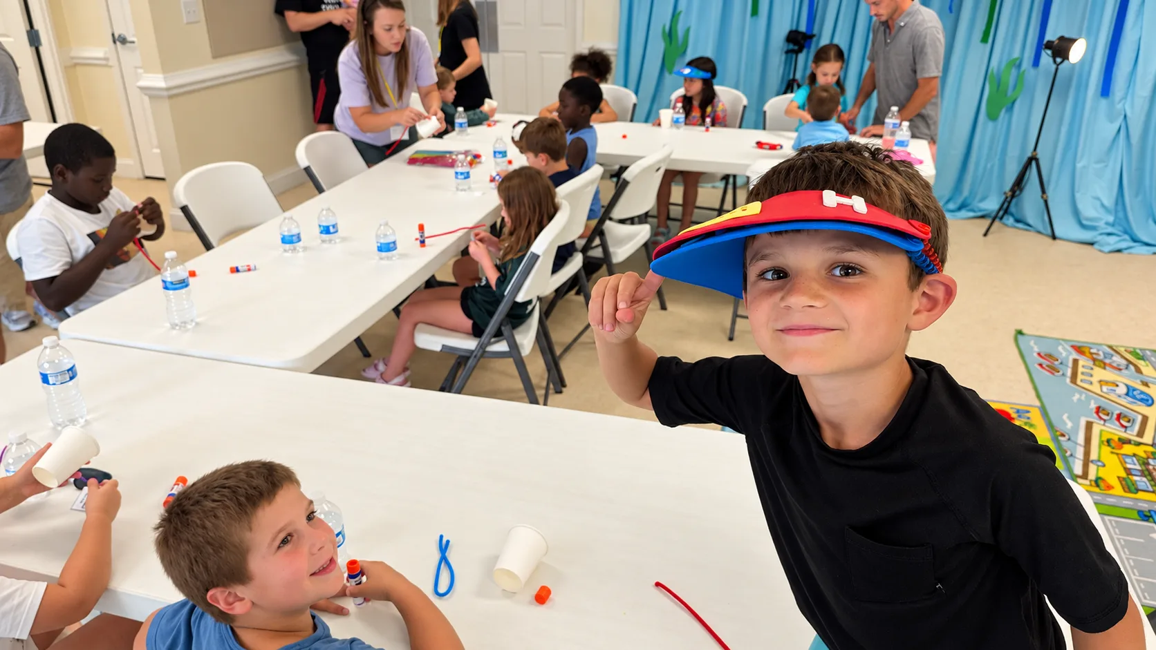 A child wearing a handmade craft during Backyard Bible Club at Rawls Baptist Church.