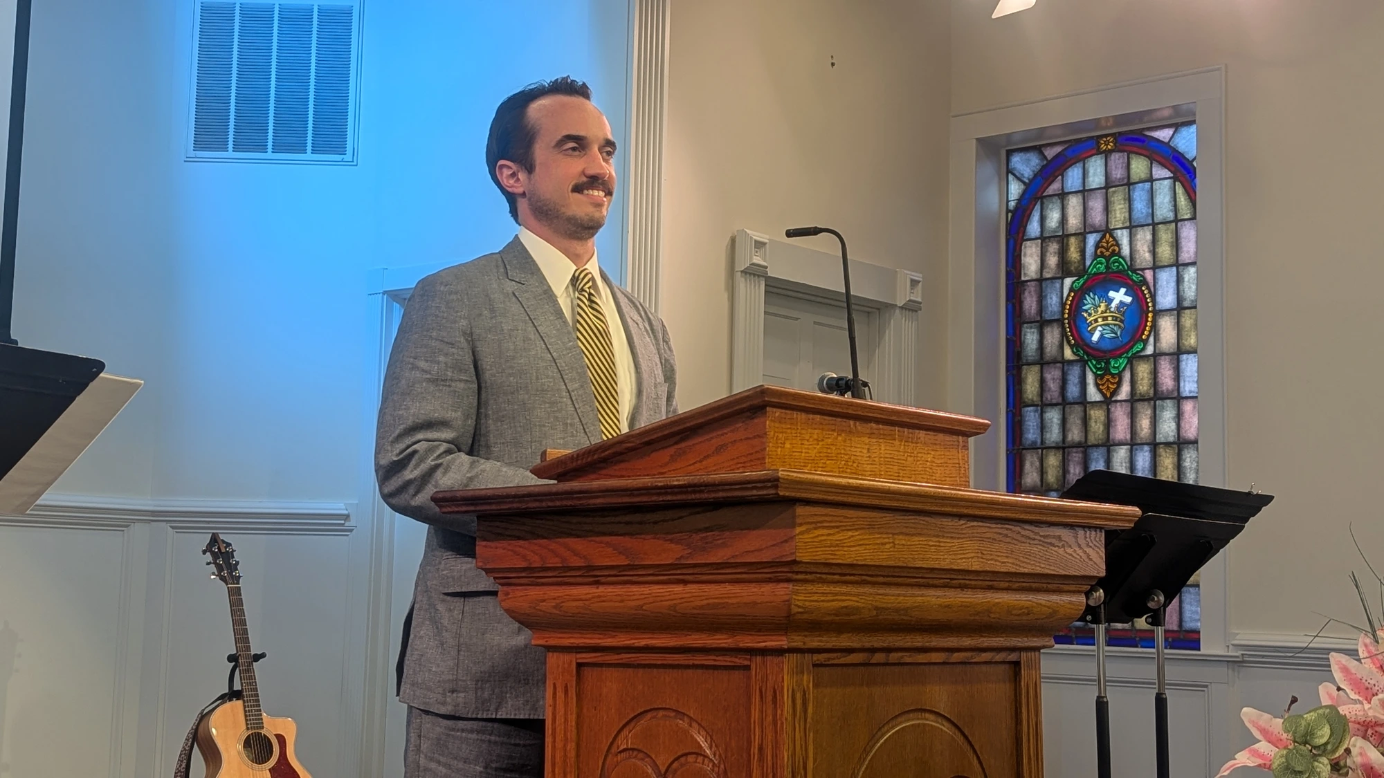 Pastor Brandon Gaster preaching during worship at Rawls Baptist Church in Fuquay-Varina, North Carolina.